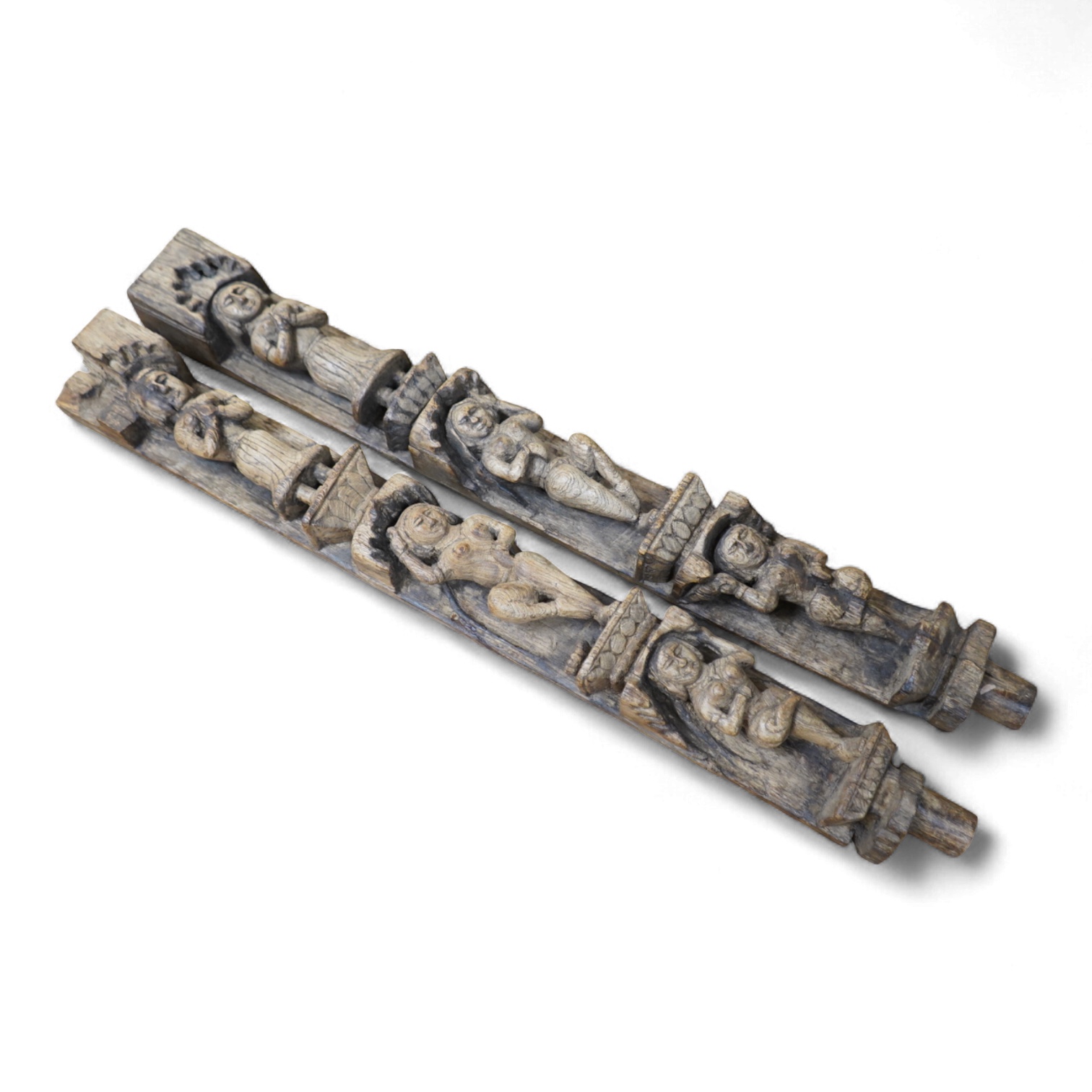A pair of 19th century Indian carved wood figural pilasters - 74cm long